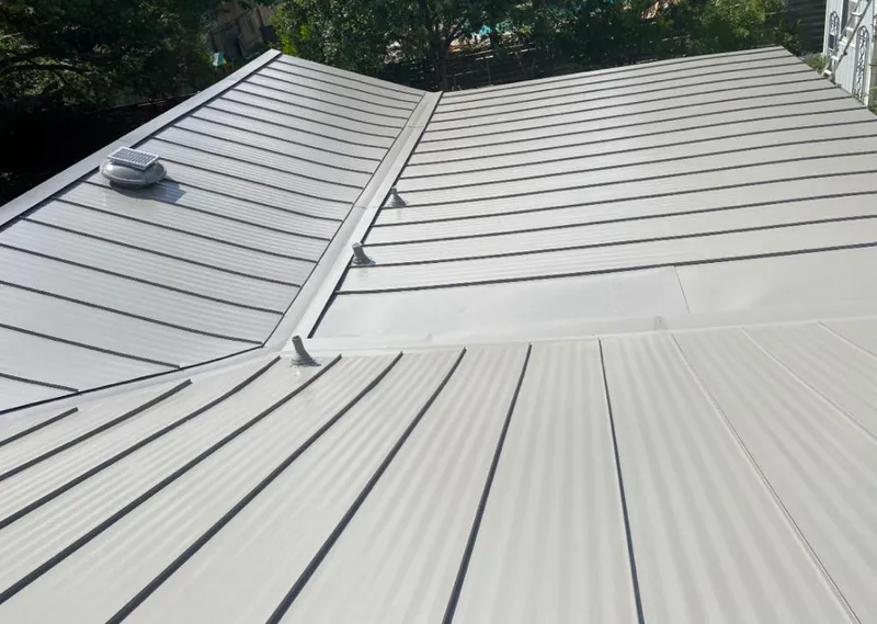Solar attic fan installed on a metal roof for Roof Ventilation in Holland